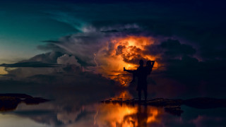 Person rock sky clouds fire - a person holding free wallpaper