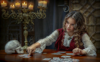 Young girl playing cards candle - tarot card free wallpaper
