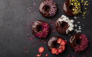 Donuts chocolate frosting sprinkles table - sprinkle free wallpaper