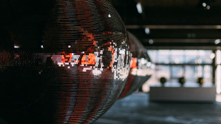 Large mirror ball building people - kinetic art free wallpaper for desktop