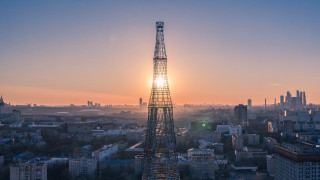 Sunset tower cityscape ferris wheel - a city in the distance free wallpaper