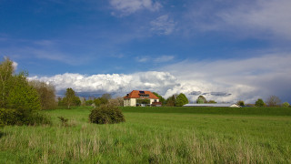 House field cloudy sky trees - a house in a field free wallpaper