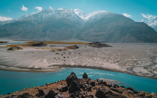 Mountain range lake shore sky - the foreground and a mountain range in the background free wallpaper for desktop