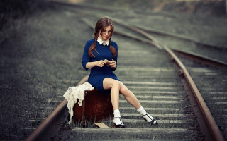 Woman sitting suitcase train track - she free wallpaper