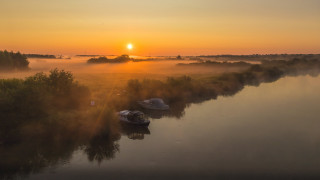 Foggy river boats sunset mountain - dave allsop free wallpaper for desktop
