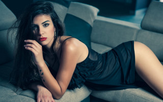 Elegant woman blackdress couch portrait - elegant free wallpaper