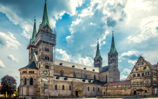 Romanesque neo gothic clock tower - a cloudy sky behind free wallpaper for desktop