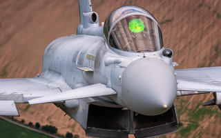 Fighterjet greenlight nose above jigsaw - a green light free wallpaper
