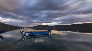 Boat water cloudy sky mountains 6 - the water under a cloudy sky free wallpaper
