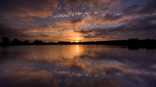 Sunset lake reflection trees clouds - a sunset over a lake free wallpaper