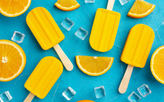 Popsicles orange slices ice cubes - a blue surface free wallpaper for desktop