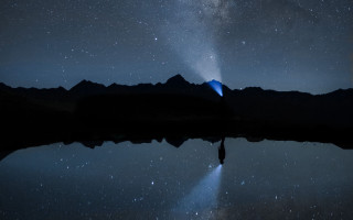 Night sky star water mountain - a mountain range in the distance free wallpaper