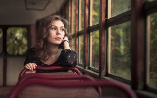 Bus woman looking out window - a bus free wallpaper