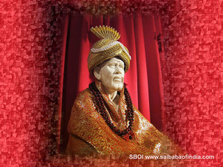 Statue man gold outfit beads - a red curtain behind free wallpaper