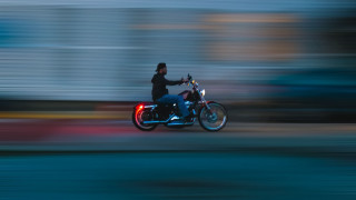 Man motorcycle street building clock - motion blur free wallpaper for desktop