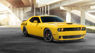 Yellow car parked bridge building 2 - a bridge and a building free wallpaper