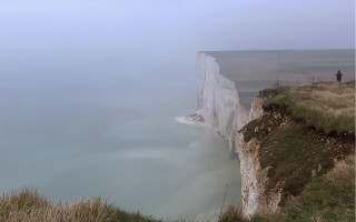 White cliff person outlook mountains - tonalism free wallpaper