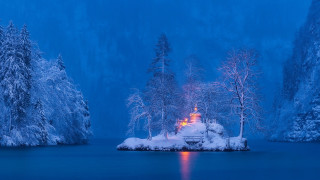 Snowy island lake night lit - house free wallpaper