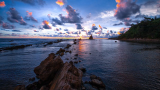 Sunset rocky beach island matte - a small island in the distance free wallpaper