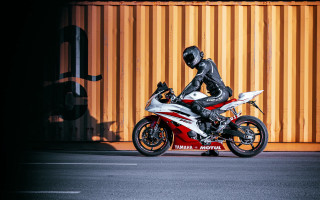 Motorcycle rider yellow wall red - stripe free wallpaper