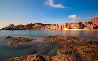 Beach buildings water rocks sunset - a bunch of buildings free wallpaper