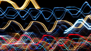 Blurry city street night clocktower - a blurry photo of a city street free wallpaper