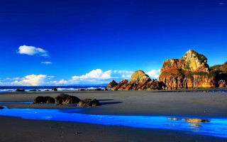 Beach rocks water blue sky - bascove free wallpaper for desktop