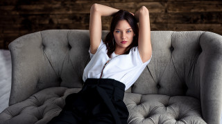 Woman sitting couch arms behind 2 - christen dalsgaard free wallpaper