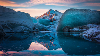 Mountain range ice water sunset - the foreground and a sunset in the background free wallpaper for desktop