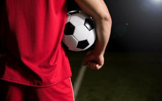 Soccer player spotlight night field - a soccer ball free wallpaper