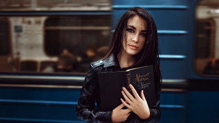 Woman holding book subway gothic - a book in her hands free wallpaper