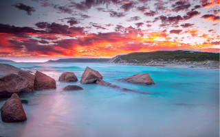 Sunset rocky beach blue water - blue water free wallpaper