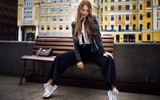 Woman sitting laptop cityscape blurry - fashion free wallpaper