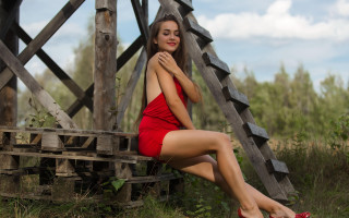 Woman red dress bench field - fashion photoshoot free wallpaper