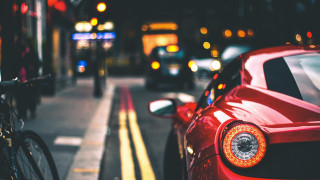 Red sports car street bokeh - the side of a street next free wallpaper