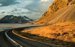 Mountain lake road clouds sunset - a lake in the middle of it free wallpaper for desktop