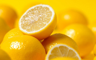 Lemon pile halved shiny orange - one cut free wallpaper
