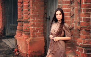 Woman brick building honeycomb fence - a brick building free wallpaper