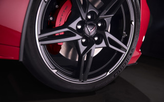 Red car wheel black background - sharp detail free wallpaper
