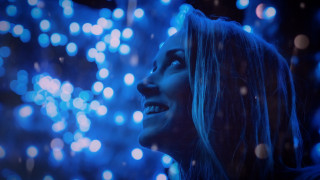 Woman smiling fireworks blue lights - looking free wallpaper for desktop