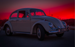 White car parking lot sunset 3 - a red sky in the background free wallpaper