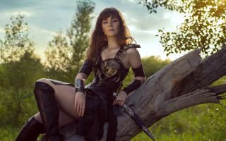Woman cosplay sitting tree branch - her hand and a sword free wallpaper