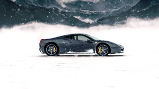 Sports car snowy field mountains - the air behind free wallpaper
