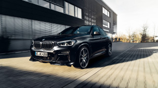 Black bmw suv street building - a garage door open free wallpaper