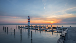 Lighthouse pier sunset clouds water 2 - a pier free wallpaper for desktop