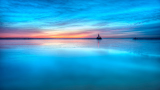 Lighthouse sunset water blue sky - the background and a boat free wallpaper