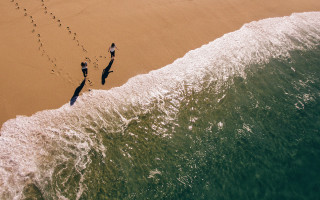 Beach footprints water wave night - footprint free wallpaper