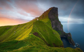 Rainbow hilly landscape house nature - a rainbow in the sky above free wallpaper