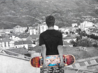 Man skateboard rooftop city view - cafer bater free wallpaper