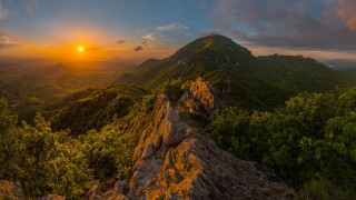 Sunset mountain rock forest lake - a sunset over a mountain free wallpaper